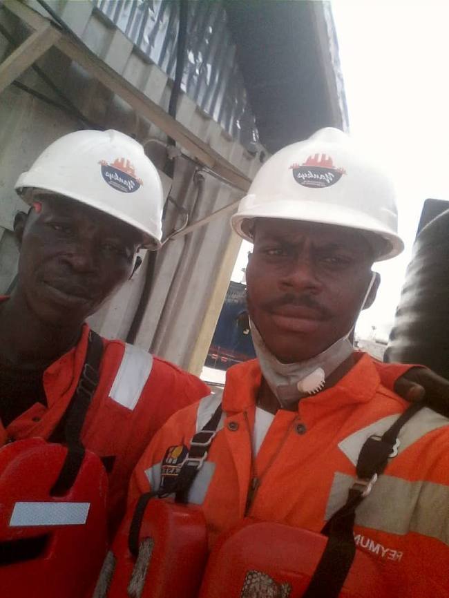 Yankys crew on site wearing branded hardhats